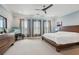 Spacious main bedroom features a ceiling fan and many windows letting in natural light at 190 Marion Ne Pl, Atlanta, GA 30307