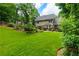 Expansive backyard featuring lush lawn, mature trees, and manicured landscaping for outdoor enjoyment at 2263 Hill Creek Way, Marietta, GA 30062