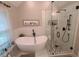 Modern bathroom featuring a soaking tub and a glass-enclosed shower at 2263 Hill Creek Way, Marietta, GA 30062