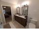 Bathroom featuring a double vanity and a glass enclosed shower at 2263 Hill Creek Way, Marietta, GA 30062