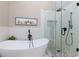 Modern bathroom with a standalone tub, glass-enclosed shower, and stylish finishes at 2263 Hill Creek Way, Marietta, GA 30062