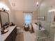 Bright bathroom with a soaking tub, glass enclosed shower, and a double vanity at 2263 Hill Creek Way, Marietta, GA 30062