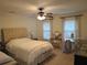 Inviting bedroom featuring a plush bed, neutral tones, and a bright window at 2263 Hill Creek Way, Marietta, GA 30062