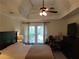 Bright bedroom with a window view and a dark wooden dresser at 2263 Hill Creek Way, Marietta, GA 30062