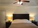 Calm bedroom with a dark wooden headboard and matching nightstands and lamps at 2263 Hill Creek Way, Marietta, GA 30062