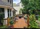 Spacious wooden deck with outdoor furniture, plants, and a scenic view at 2263 Hill Creek Way, Marietta, GA 30062