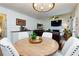 Charming dining area with a round wood table and views into the living room at 2263 Hill Creek Way, Marietta, GA 30062