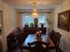 Elegant dining room with a chandelier, dark wood table, and decorative buffet at 2263 Hill Creek Way, Marietta, GA 30062