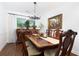 Dining room with a large table with ornate chairs, hardwood floor, and natural lighting at 2263 Hill Creek Way, Marietta, GA 30062