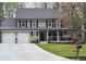 Charming two-story home boasts a welcoming front porch and well-maintained landscaping at 2263 Hill Creek Way, Marietta, GA 30062