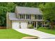 Charming two-story home with a well-manicured lawn and two-car garage at 2263 Hill Creek Way, Marietta, GA 30062