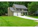 Charming two-story home with a well-manicured lawn and two-car garage at 2263 Hill Creek Way, Marietta, GA 30062