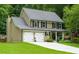 Charming two-story home with a well-manicured lawn and two-car garage at 2263 Hill Creek Way, Marietta, GA 30062