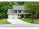 Charming two-story home with a well-manicured lawn, two-car garage, and inviting front porch at 2263 Hill Creek Way, Marietta, GA 30062