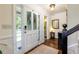 Bright foyer with beautiful floors, decorative mirror, and glass-paneled door at 2263 Hill Creek Way, Marietta, GA 30062