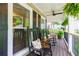 Inviting front porch with rocking chairs, ferns, and ample space for relaxing at 2263 Hill Creek Way, Marietta, GA 30062