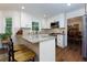 Bright kitchen featuring granite countertops, stainless steel appliances, and wooden floors at 2263 Hill Creek Way, Marietta, GA 30062