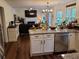 Open-concept kitchen featuring granite countertops, stainless steel appliances, and seamless views of the living area at 2263 Hill Creek Way, Marietta, GA 30062