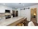 Updated kitchen with granite counters, stainless appliances and sliding barn door at 2263 Hill Creek Way, Marietta, GA 30062