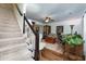 Carpeted stairs near living room with wood-style flooring and comfortable seating area at 2263 Hill Creek Way, Marietta, GA 30062