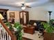 Comfortable living room with hardwood floors, a ceiling fan, and views into the dining area at 2263 Hill Creek Way, Marietta, GA 30062