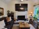 Inviting living room featuring a fireplace, flatscreen television, and hardwood floors at 2263 Hill Creek Way, Marietta, GA 30062