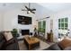 Inviting living room with a fireplace, vaulted ceiling, and natural light at 2263 Hill Creek Way, Marietta, GA 30062