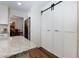 Functional pantry with sliding barn door for easy access and storage at 2263 Hill Creek Way, Marietta, GA 30062