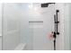 Contemporary shower features white subway tile, a built-in niche, and a sleek black rainfall shower head at 2263 Hill Creek Way, Marietta, GA 30062