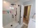 This modern shower features subway tile, a rainfall shower head, and sleek glass doors at 2263 Hill Creek Way, Marietta, GA 30062