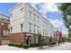 Charming townhome with brick accents, large windows, and manicured landscaping at 306 Masons Row, Marietta, GA 30060