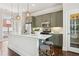 Modern kitchen with stainless steel appliances, ample counter space, and convenient access to the balcony at 306 Masons Row, Marietta, GA 30060