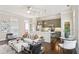 Open-concept living space with kitchen island, stylish decor, and ample natural light at 306 Masons Row, Marietta, GA 30060
