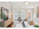 Bright living room with stylish decor, hardwood floors, and comfortable seating arrangements at 306 Masons Row, Marietta, GA 30060