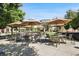Community offers outdoor seating area with umbrellas, providing a comfortable and inviting space for residents at 306 Masons Row, Marietta, GA 30060