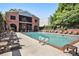 Community pool area with lounge chairs and a covered pavilion for relaxing and socializing at 306 Masons Row, Marietta, GA 30060