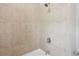 Clean shower with neutral-colored tiling and modern fixtures in the bathroom at 306 Masons Row, Marietta, GA 30060