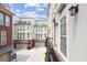 View of modern townhomes with private balconies and garages from a unique vantage point at 306 Masons Row, Marietta, GA 30060