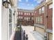 Exterior view of a community of well-maintained townhomes with brick and stucco facades at 306 Masons Row, Marietta, GA 30060