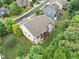 Aerial view of house showcasing the backyard, deck, patio, roof, surrounding landscaping and neighborhood at 3157 Perimeter Cir, Buford, GA 30519