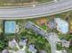 Aerial view of community amenities including tennis courts, playground, pool, and clubhouse near a highway at 3157 Perimeter Cir, Buford, GA 30519