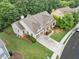 Aerial shot of the house featuring backyard, deck, roof, landscaping and nearby neighborhood at 3157 Perimeter Cir, Buford, GA 30519