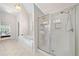 Well-lit bathroom featuring a soaking tub and separate glass shower at 3157 Perimeter Cir, Buford, GA 30519