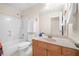 Full bathroom with tub and shower combo, ceramic tile flooring, and a wood vanity cabinet at 3157 Perimeter Cir, Buford, GA 30519