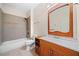 Full bathroom with tub and shower combo, tile flooring, and a wood vanity cabinet at 3157 Perimeter Cir, Buford, GA 30519