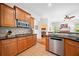 Beautiful kitchen with tile backsplash, granite countertops, stainless appliances, and easy access to the living room at 3157 Perimeter Cir, Buford, GA 30519