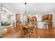 Charming kitchen with wood floors, kitchen table, stainless steel appliances, and ample storage at 3157 Perimeter Cir, Buford, GA 30519