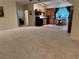 Open floor plan featuring a large living area leading to a small kitchen and dining area at 3157 Perimeter Cir, Buford, GA 30519
