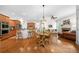 Open-concept kitchen and living space with hardwood floors and natural light at 3157 Perimeter Cir, Buford, GA 30519