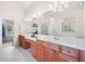 Bright main bathroom features double vanities, large mirrors and ample storage at 3157 Perimeter Cir, Buford, GA 30519